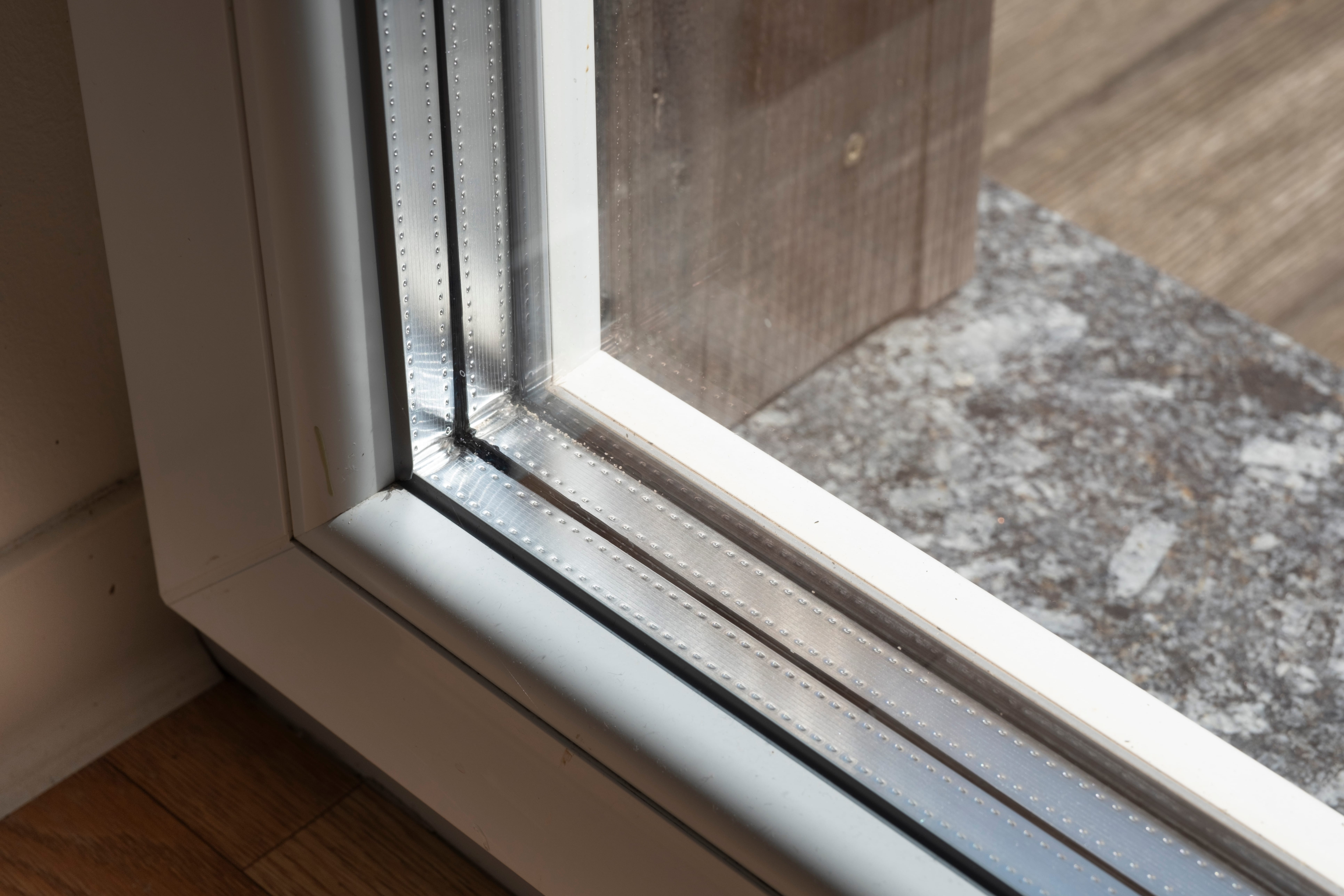 detail,of,a,window,frame,with,triple,glazing.,the,space