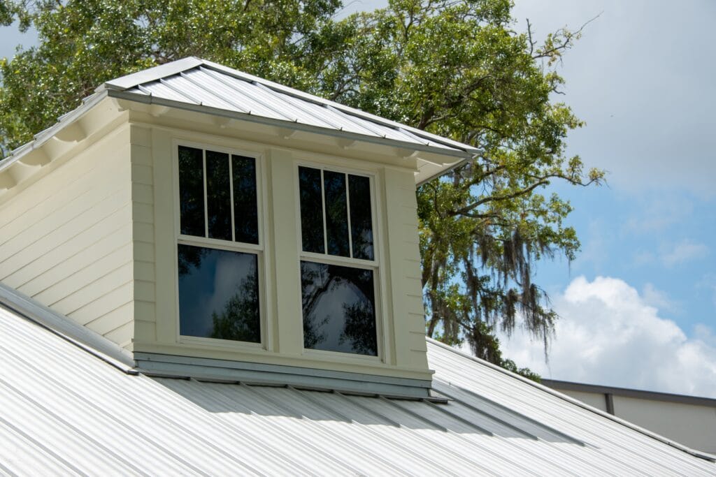 a,dormer,with,multiple,double,hung,windows,,a,grey,metal