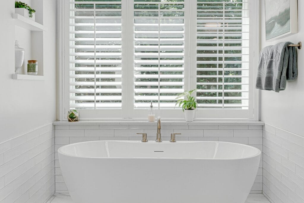 modern,luxury,soaking,tub,with,brass,faucet,interior,design,staged