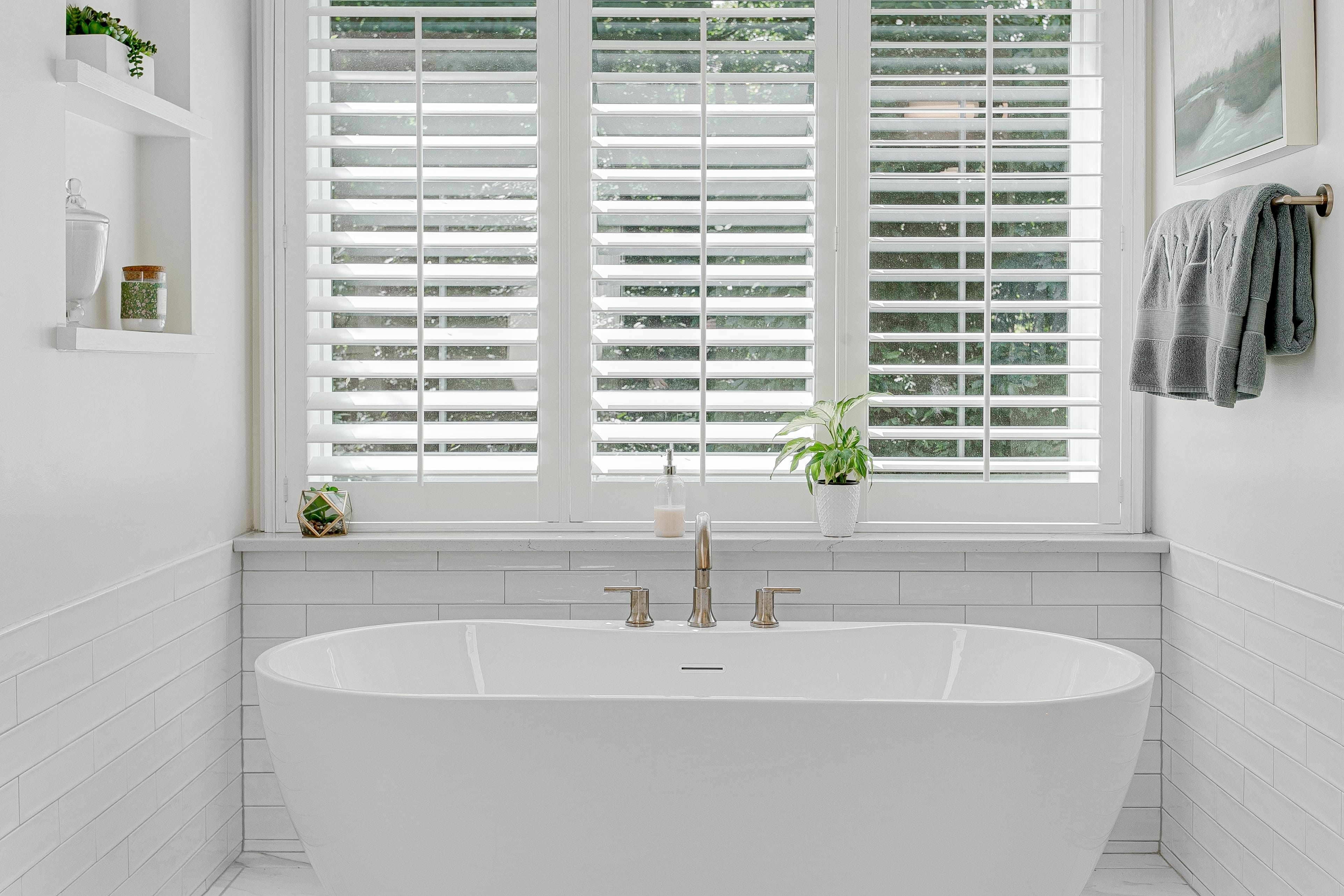 modern,luxury,soaking,tub,with,brass,faucet,interior,design,staged