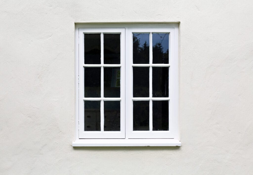 wooden,windows,and,sill,on,a,home,exterior.,cottage,windows,