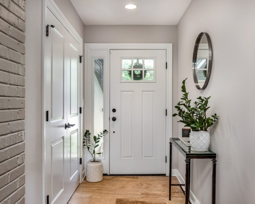 a,cozy,entryway,with,brown,and,brick,walls,,hardwood,flooring,